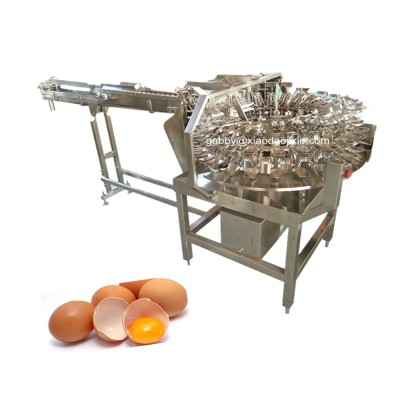 Egg breaking machine with separating